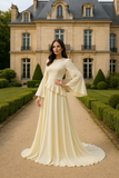 Robe Eulalie longue à volants superposés et manches fluides